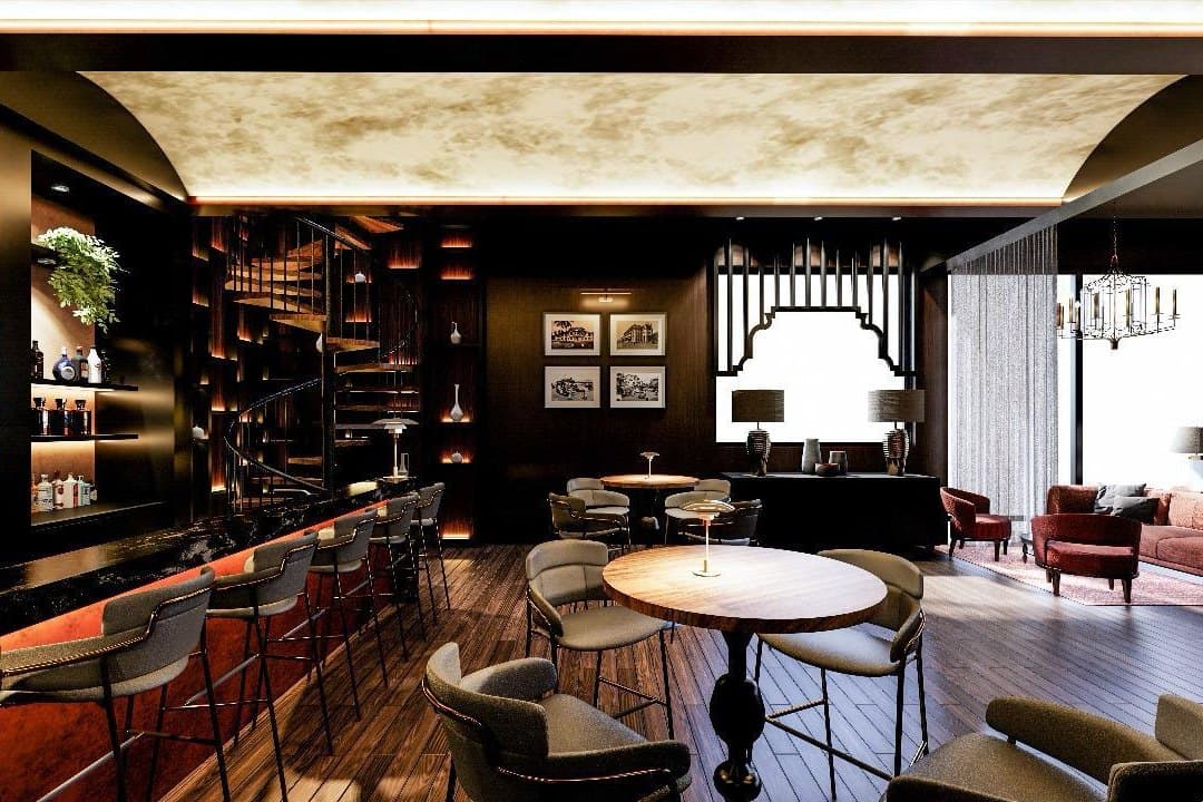 Artist’s impression of a long counter with stools, café tables and low seating beyond, under a lit vaulted ceiling.