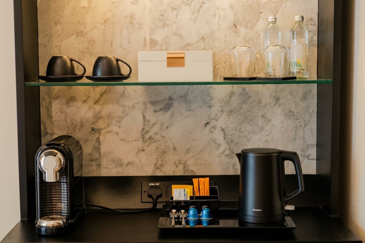 Photograph of the coffee maker in a Deluxe Room.
