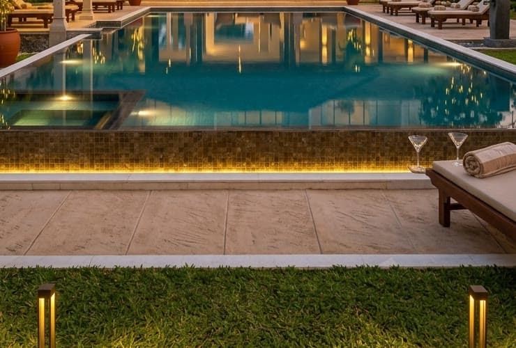 Artist’s impression of a plunge pool at dusk with the ocean beyond.